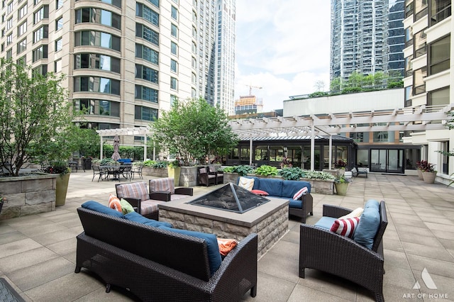 400 E Ohio St Unit 2302, Chicago, IL 60611 - view of patio / terrace with an outdoor living space with a fire pit and a pergola