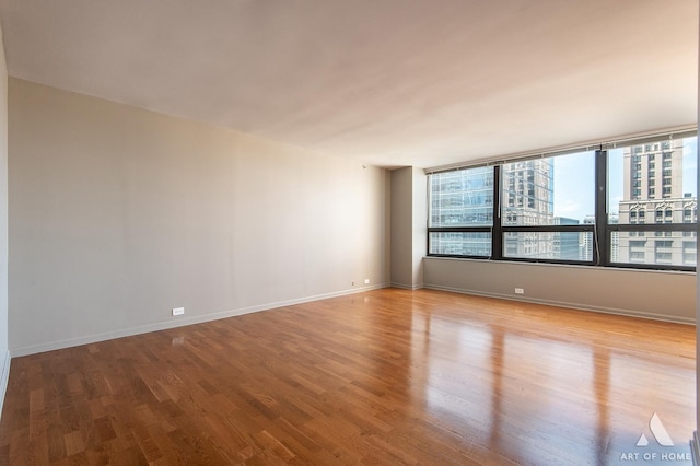 400 E Ohio St Unit 2302, Chicago, IL 60611 - unfurnished room with wood finished floors and a city view
