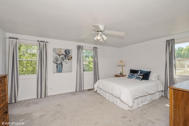 881 Twisted Oak Ln, Buffalo Grove, IL 60089 - bedroom with light colored carpet, multiple windows, and ceiling fan