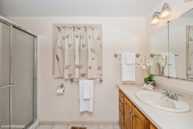 881 Twisted Oak Ln, Buffalo Grove, IL 60089 - bathroom featuring vanity, a shower with door, and tile patterned floors