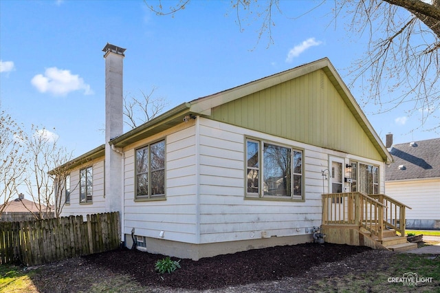 1022 Cora St, Joliet, IL 60435 - rear view of house with a chimney