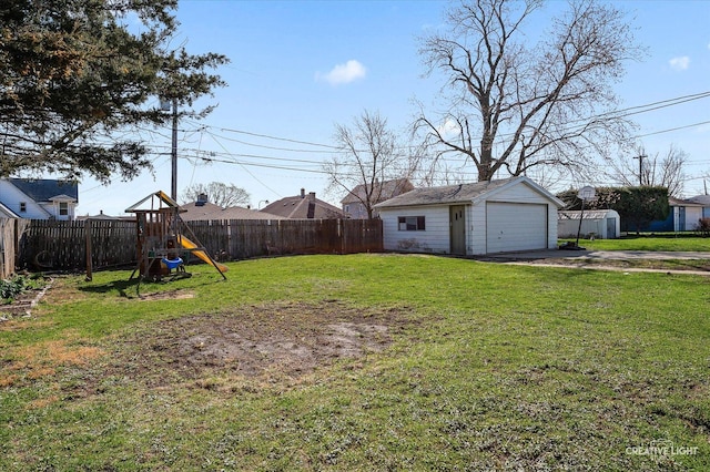 1022 Cora St, Joliet, IL 60435 - fenced backyard with a garage, a playground, and a storage shed