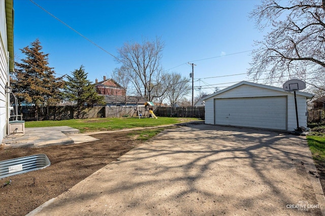 1022 Cora St, Joliet, IL 60435 - view of yard with a garage, a playground, and an outbuilding