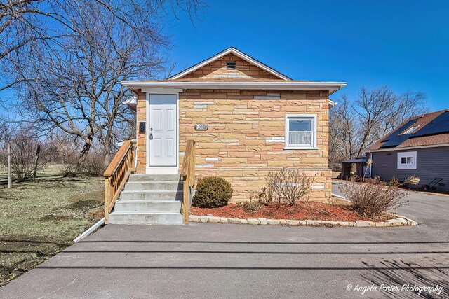 208 W Nippersink Rd, Round Lake, IL 60073 - view of front of house featuring stone siding