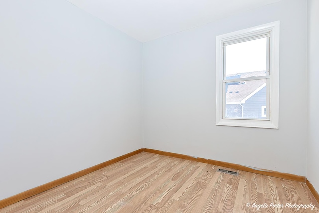 208 W Nippersink Rd, Round Lake, IL 60073 - empty room featuring baseboards and light wood-type flooring