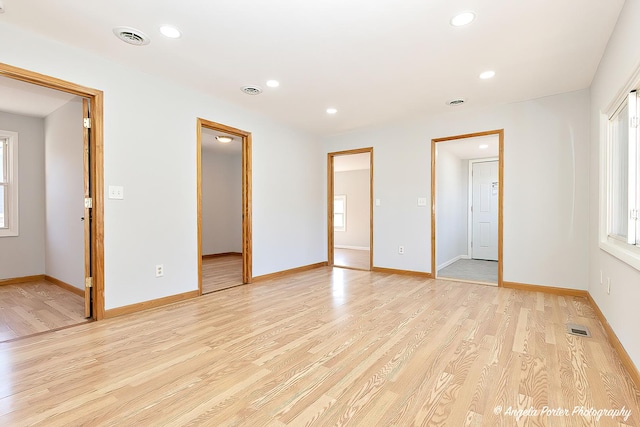 208 W Nippersink Rd, Round Lake, IL 60073 - unfurnished bedroom with light wood finished floors, recessed lighting, and multiple windows