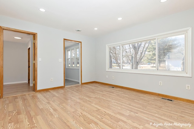 208 W Nippersink Rd, Round Lake, IL 60073 - empty room with light wood finished floors and recessed lighting