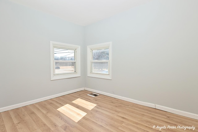 208 W Nippersink Rd, Round Lake, IL 60073 - unfurnished room featuring wood finished floors and baseboards