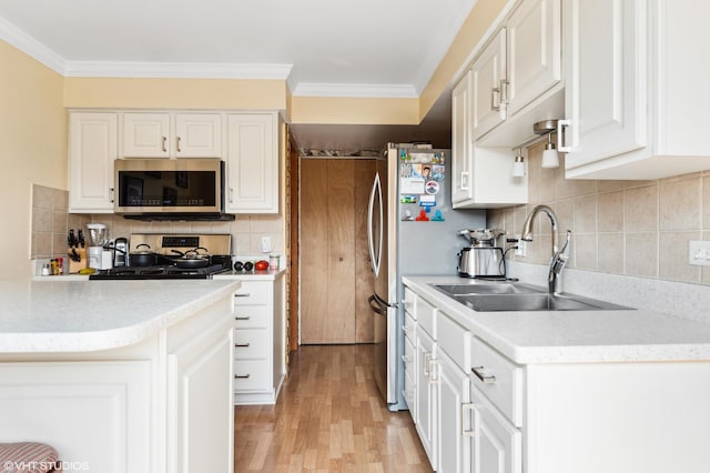 7330 Winthrop Way Unit 2, Downers Grove, IL 60515 - kitchen with stainless steel microwave, stove, white cabinets, crown molding, and decorative backsplash