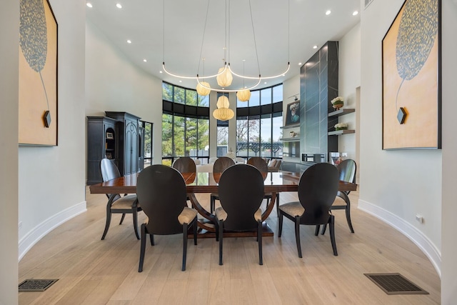2110 Pfingsten Rd, Northbrook, IL 60062 - dining space with recessed lighting, light wood-style flooring, and a high ceiling