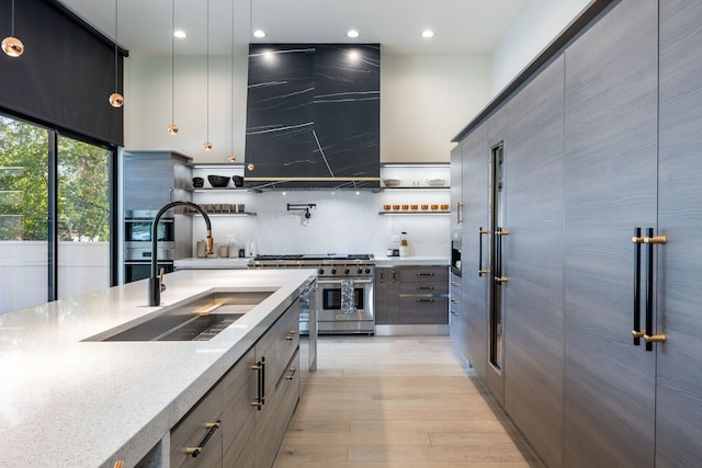2110 Pfingsten Rd, Northbrook, IL 60062 - kitchen featuring high end stainless steel range oven, modern cabinets, open shelves, light wood-type flooring, and backsplash