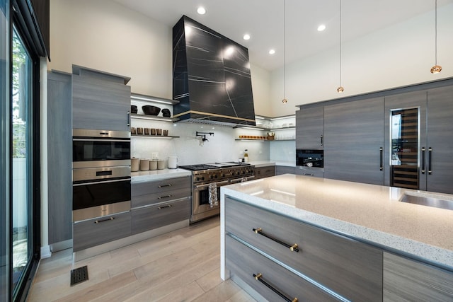 2110 Pfingsten Rd, Northbrook, IL 60062 - kitchen with stainless steel appliances, modern cabinets, open shelves, recessed lighting, and high vaulted ceiling