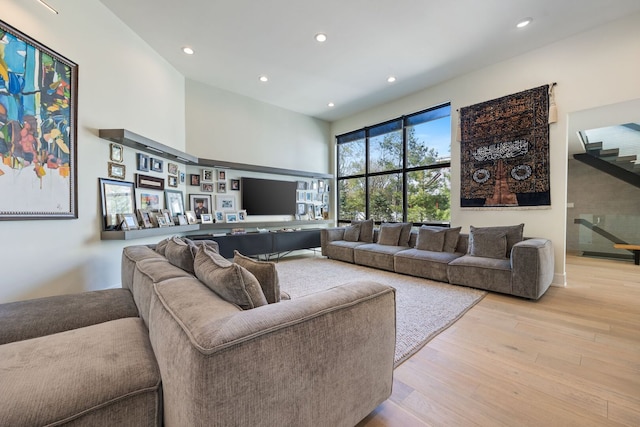 2110 Pfingsten Rd, Northbrook, IL 60062 - living area with light wood-style floors, a towering ceiling, and recessed lighting