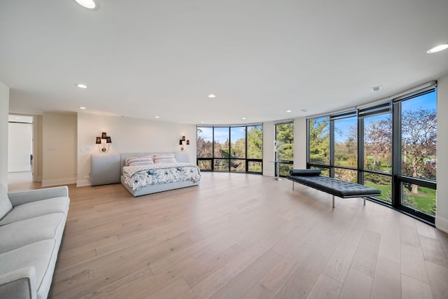 2110 Pfingsten Rd, Northbrook, IL 60062 - bedroom featuring a wall of windows, recessed lighting, and light wood-type flooring