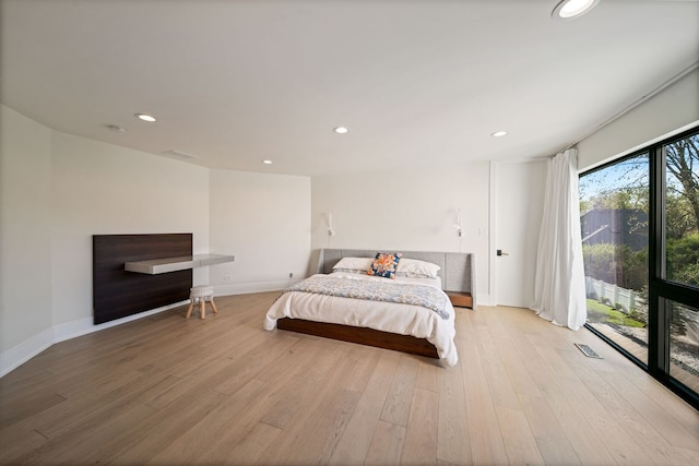 2110 Pfingsten Rd, Northbrook, IL 60062 - bedroom with light wood-style flooring, recessed lighting, and access to exterior