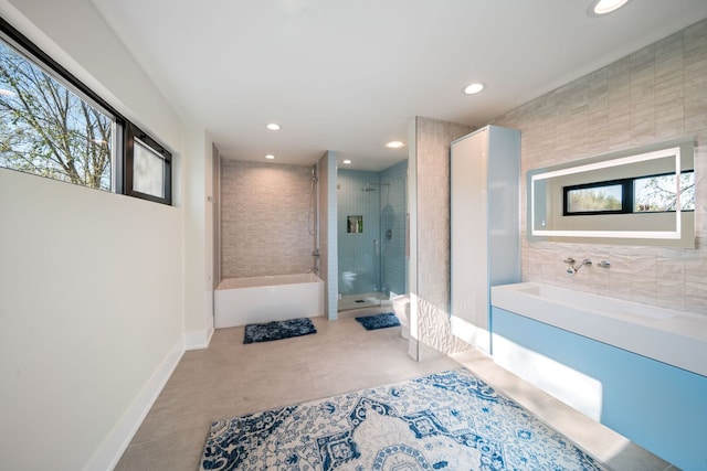 2110 Pfingsten Rd, Northbrook, IL 60062 - bathroom featuring a bath, a stall shower, recessed lighting, and tile patterned floors