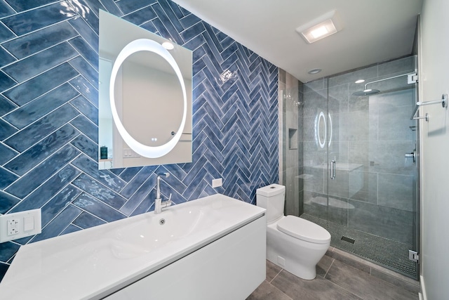 2110 Pfingsten Rd, Northbrook, IL 60062 - full bathroom featuring tile walls, a shower stall, vanity, and tile patterned floors