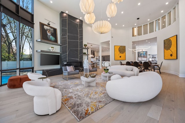 2110 Pfingsten Rd, Northbrook, IL 60062 - living room with a towering ceiling, hardwood / wood-style flooring, and recessed lighting