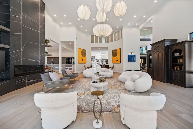 2110 Pfingsten Rd, Northbrook, IL 60062 - living area featuring a high ceiling, wood finished floors, and recessed lighting