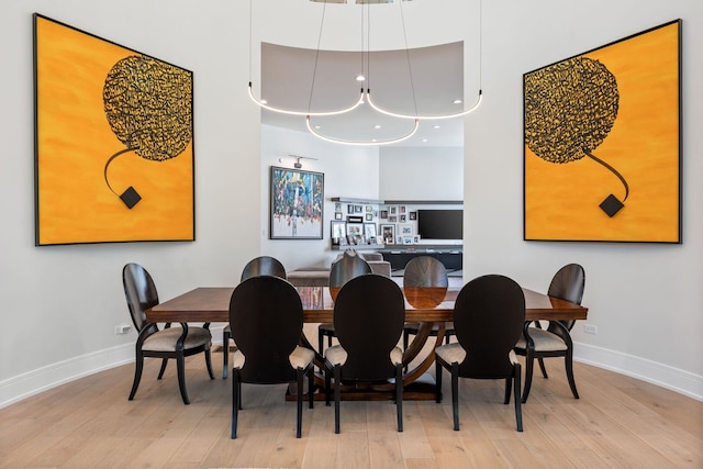 2110 Pfingsten Rd, Northbrook, IL 60062 - dining space with baseboards and light wood-style floors