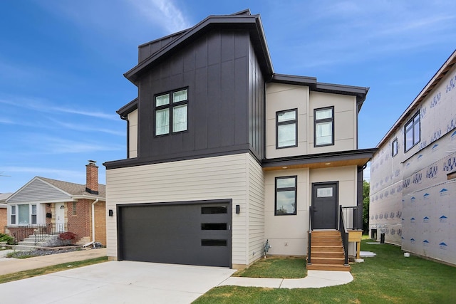 5041 N Octavia Ave, Harwood Heights, IL 60706 - contemporary home with a garage, concrete driveway, board and batten siding, and entry steps