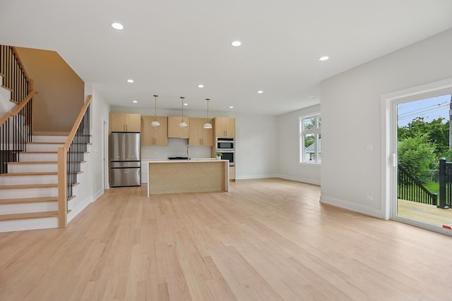 5041 N Octavia Ave, Harwood Heights, IL 60706 - unfurnished living room with light wood-style flooring, stairs, and recessed lighting