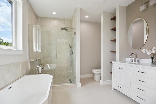 5041 N Octavia Ave, Harwood Heights, IL 60706 - bathroom featuring a soaking tub, vanity, a stall shower, tile patterned flooring, and recessed lighting