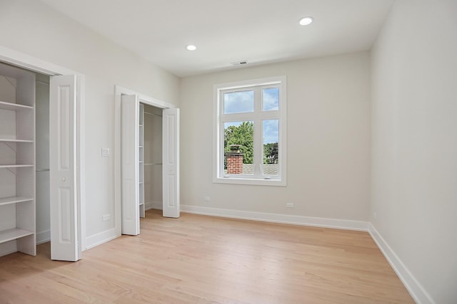 5041 N Octavia Ave, Harwood Heights, IL 60706 - unfurnished bedroom with light wood-style flooring and recessed lighting
