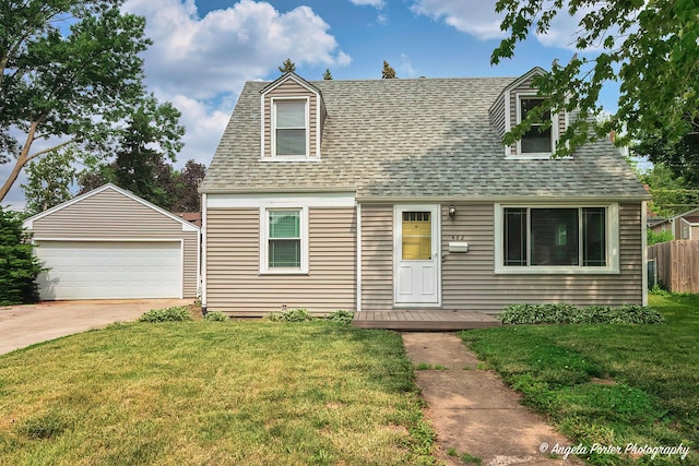 482 S Alfred Ave, Elgin, IL 60123 - new england style home featuring an outdoor structure, a detached garage, and a shingled roof