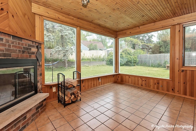 482 S Alfred Ave, Elgin, IL 60123 - unfurnished sunroom with tile patterned floors and wood walls