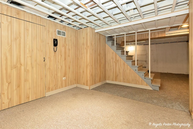 482 S Alfred Ave, Elgin, IL 60123 - finished below grade area featuring stairway, carpet, and wood walls