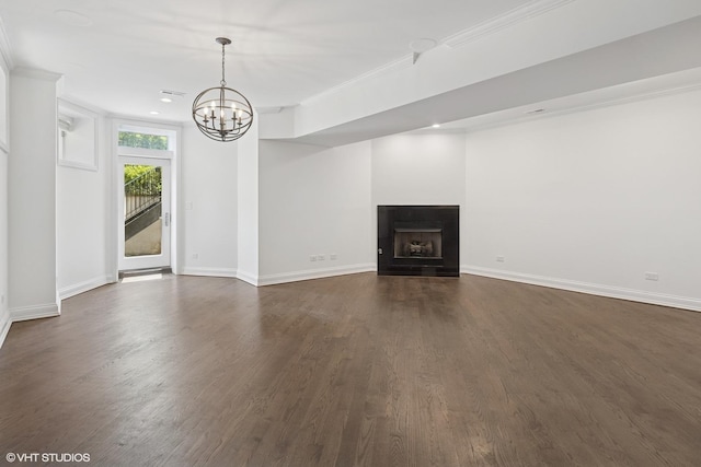 506 W Oakdale Ave Unit 1, Chicago, IL 60657 - unfurnished living room featuring a chandelier, dark wood-type flooring, ornamental molding, a fireplace, and recessed lighting