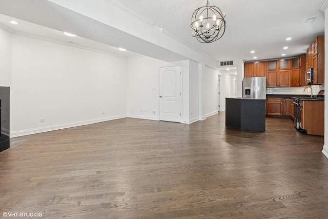 506 W Oakdale Ave Unit 1, Chicago, IL 60657 - kitchen featuring stainless steel appliances, open floor plan, a chandelier, dark wood-style flooring, and recessed lighting