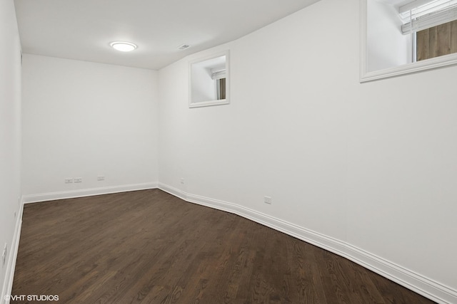 506 W Oakdale Ave Unit 1, Chicago, IL 60657 - basement with dark wood-style flooring and baseboards