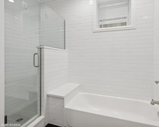 506 W Oakdale Ave Unit 1, Chicago, IL 60657 - bathroom featuring a shower with door and a tub to relax in