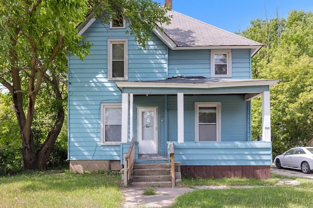 1121 Blaisdell St, Rockford, IL 61101 - traditional style home with covered porch, a chimney, and a shingled roof