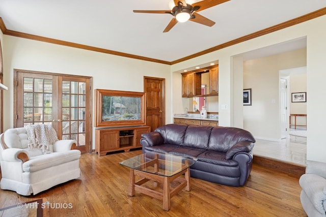 10603 Royal Porthcawl Dr, Naperville, IL 60564 - living room with light wood-style floors, a ceiling fan, crown molding, and french doors