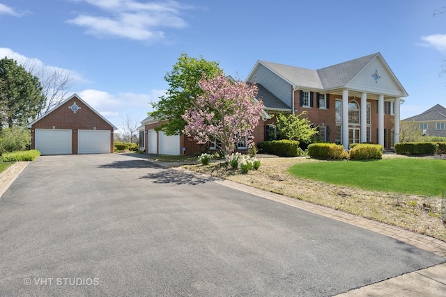 10603 Royal Porthcawl Dr, Naperville, IL 60564 - neoclassical home featuring a garage, a front yard, and brick siding