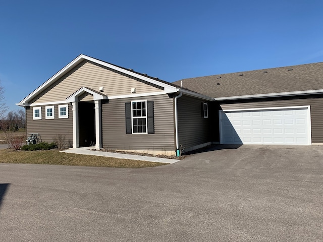 6453 Juniper Dr, Wonder Lake, IL 60097 - ranch-style home with asphalt driveway and a garage