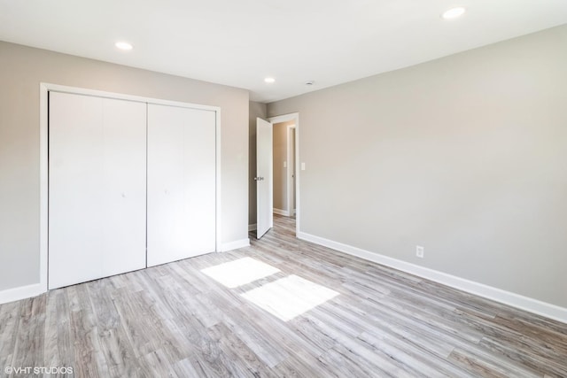 407 S York Rd, Bensenville, IL 60106 - unfurnished bedroom featuring wood finished floors, a closet, and recessed lighting