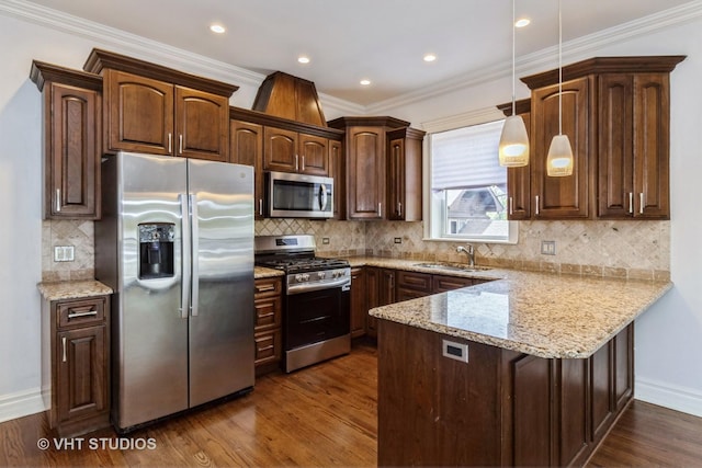 4714 W Berteau Ave Unit 1N, Chicago, IL 60641 - kitchen with appliances with stainless steel finishes, a peninsula, dark wood finished floors, light stone counters, and crown molding