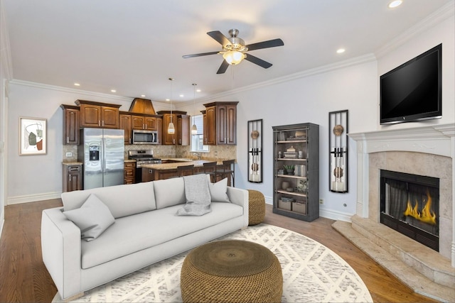 4714 W Berteau Ave Unit 1N, Chicago, IL 60641 - living area featuring ceiling fan, recessed lighting, wood finished floors, a high end fireplace, and crown molding