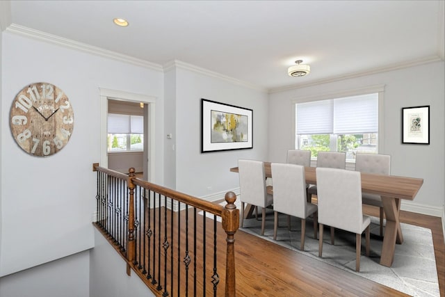 4714 W Berteau Ave Unit 1N, Chicago, IL 60641 - dining space featuring wood finished floors, ornamental molding, and recessed lighting