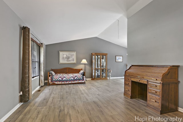 7 Kensington Ct, Streamwood, IL 60107 - bedroom featuring wood finished floors and lofted ceiling