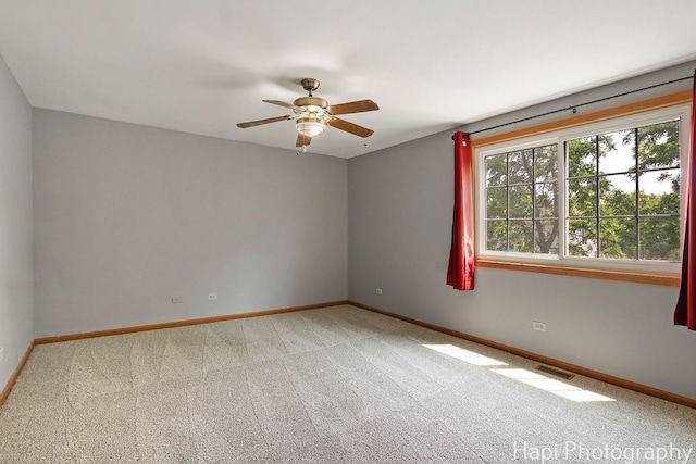 7 Kensington Ct, Streamwood, IL 60107 - empty room featuring light colored carpet and ceiling fan