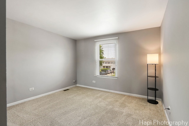 7 Kensington Ct, Streamwood, IL 60107 - carpeted spare room with baseboards