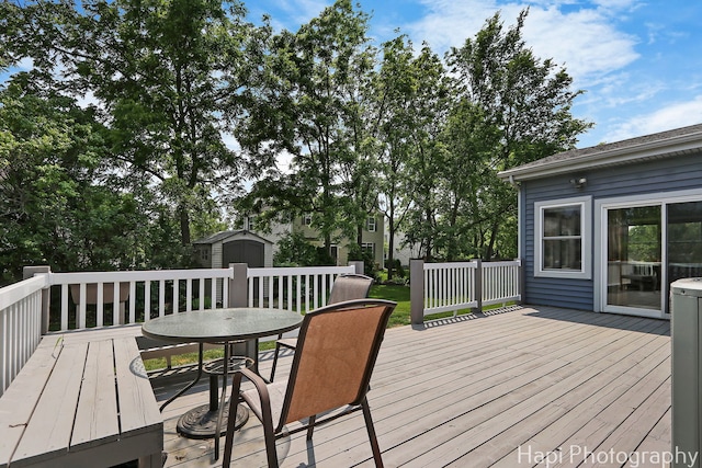 7 Kensington Ct, Streamwood, IL 60107 - deck featuring a storage shed and outdoor dining space