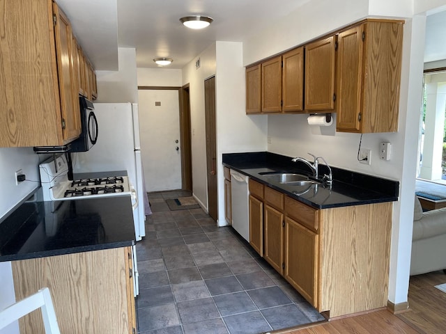 3S043 Timber Dr Unit 043, Warrenville, IL 60555 - kitchen featuring dishwasher, dark countertops, and brown cabinets