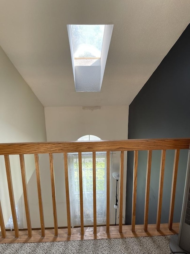 3S043 Timber Dr Unit 043, Warrenville, IL 60555 - staircase featuring a skylight and wood finished floors