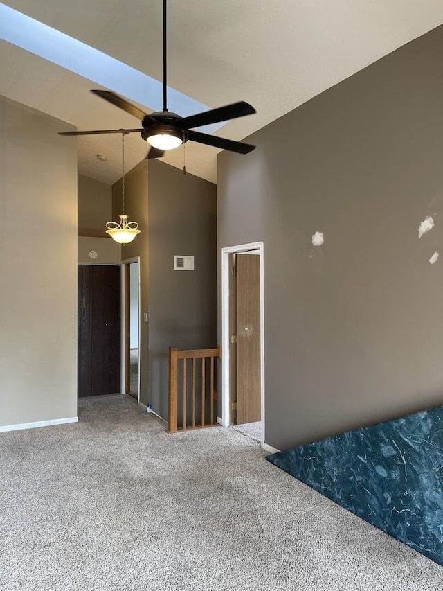 3S043 Timber Dr Unit 043, Warrenville, IL 60555 - spare room featuring carpet, high vaulted ceiling, and a ceiling fan